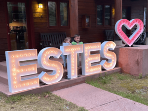 Event at Estes park with Marquee letters "Estes" and a heart.