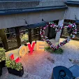 Event in courtyard with heart flower and Marquee letters spelling out "LOVE